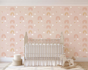 Dreamy Rainbows wallpaper featuring hand-drawn rainbows and clouds in pink, ideal for modern baby nursery and playroom decor.
