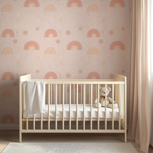 Pastel Rainbow Delight Wallpaper with pink rainbows and sunbursts in a baby nursery, perfect for modern design and playrooms.