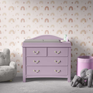 Cozy nursery with Sunshine and Rainbows II wallpaper featuring pastel rainbows, suns, and foliage, perfect for modern playroom design.