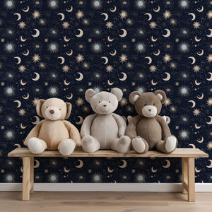 Night Sky Magic Wallpaper: moons, stars, suns on midnight blue with teddy bears; perfect for nursery, playroom, or kids' space.