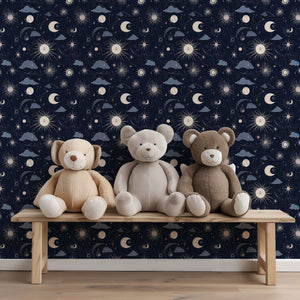 Celestial night sky wallpaper in nursery with teddy bears, featuring moons and stars, ideal for modern children’s rooms and playrooms.