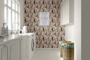Laundry room featuring Rustic Desert Blooms wallpaper with hand-drawn cacti, blending terracotta and sienna tones. Boho-chic toile design.