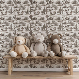 Desert Toile Elegance wallpaper with cacti and succulents in monochrome, featuring teddy bears on a wooden bench.