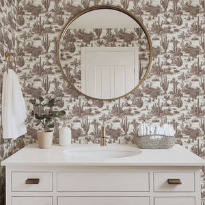 Bathroom with Desert Toile Elegance II Wallpaper featuring cacti in sepia tones, styled with modern decor. Keywords: toile, wallpaper.