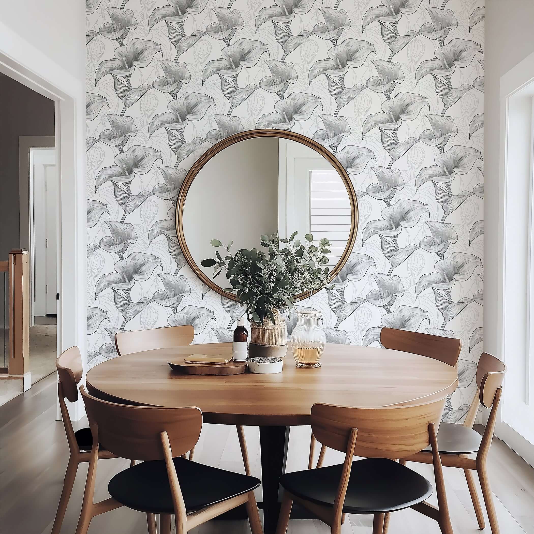 Stylish dining room with Monochrome Lily Grace wallpaper, featuring detailed calla lilies and a modern design in grayscale.