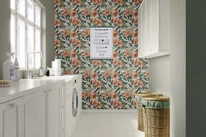 Laundry room featuring "Botanical Breeze" tropical wallpaper with coral flowers and green foliage, adding coastal style.