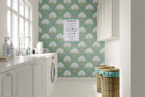 Elegant Lotus Luxe Vintage wallpaper with lotus flowers, teal background, artfully decorates a modern laundry room.