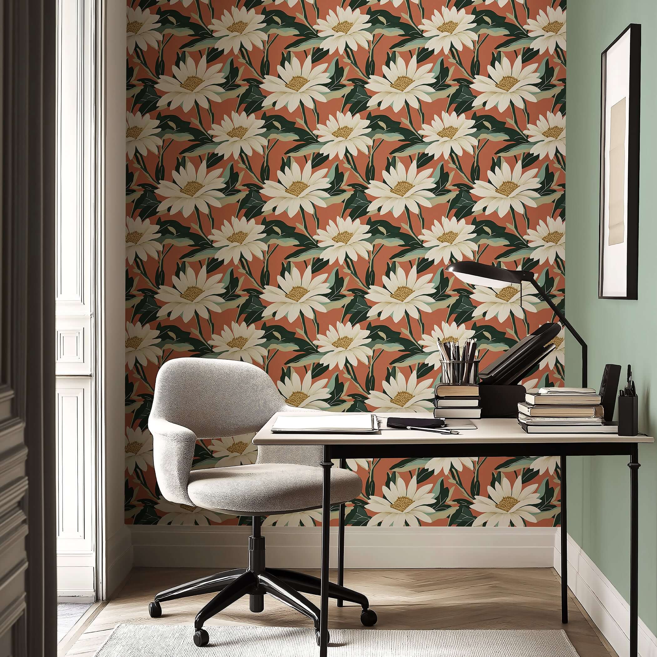 Contemporary wallpaper featuring ivory daisies and rich green foliage against a salmon terracotta background in a stylish home office.
