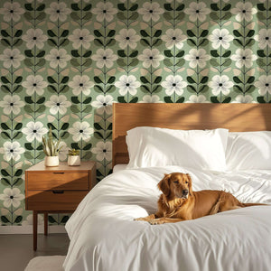 Mid-century modern bedroom with Vintage Sage Blossom wallpaper, featuring white flowers and green leaves, enhancing the serene decor.