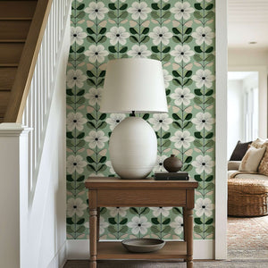 Mid-century modern wallpaper with white floral design on sage green background, enhancing retro appeal and green interior design.