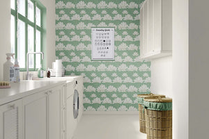Modern laundry room with Zen Lotus Garden wallpaper featuring white lotus flowers on a mint green background.
