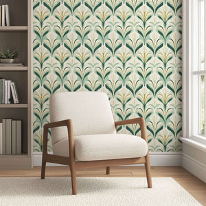 Vintage Verdant Glamour wallpaper with art deco green and gold botanical pattern, featuring modern chair in a stylish room.