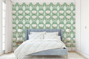Art Deco wallpaper with stylized white tulips and gold accents on a sage background, enhancing a bedroom's elegance.