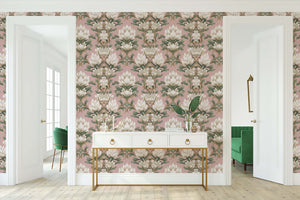 Deco Floral Majesty wallpaper with white florals and green foliage on a mauve background, featuring timeless damask and Art Deco elements.