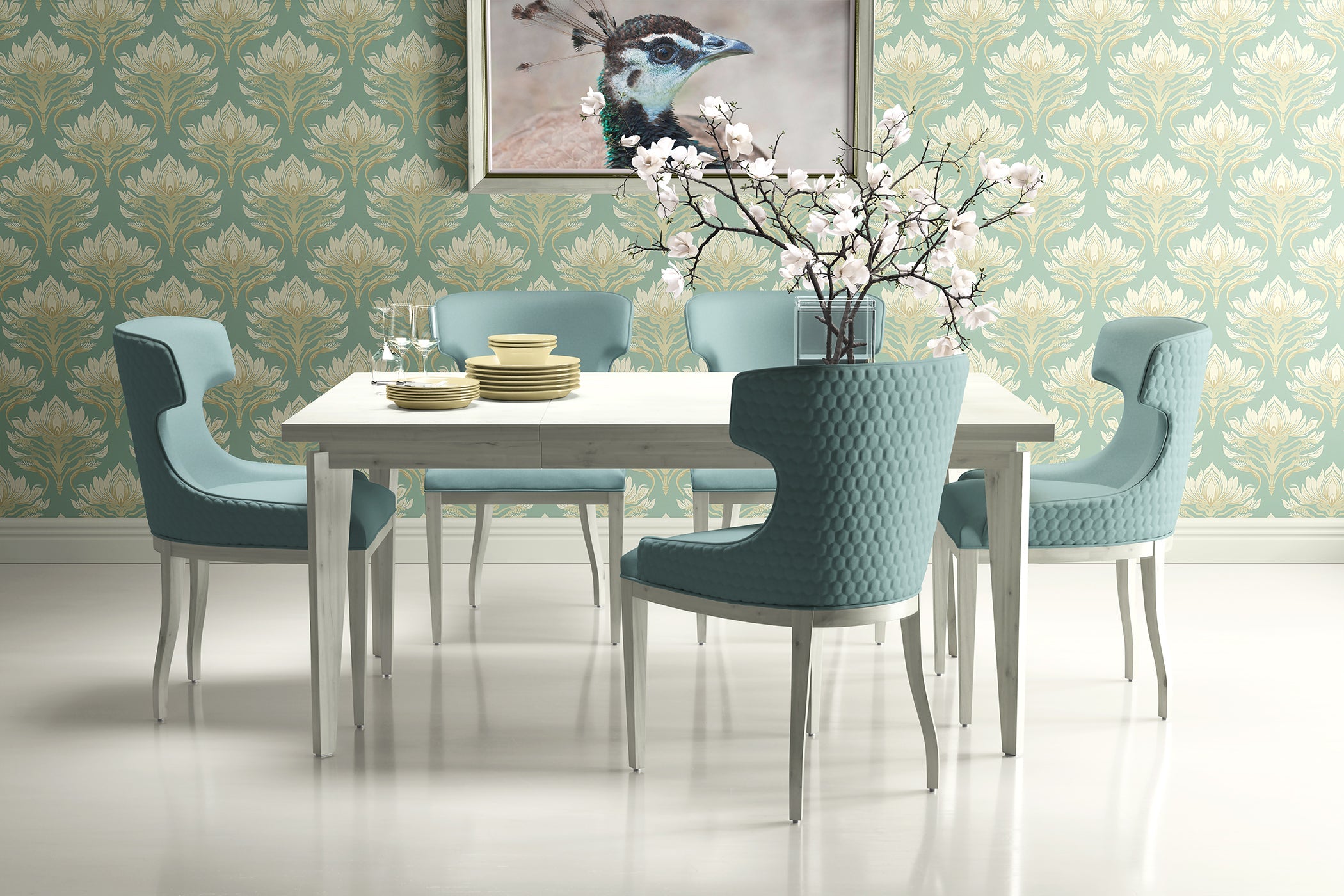 Dining room with teal damask floral wallpaper, modern table, soft blue chairs, and art piece, creating a tranquil and elegant space.