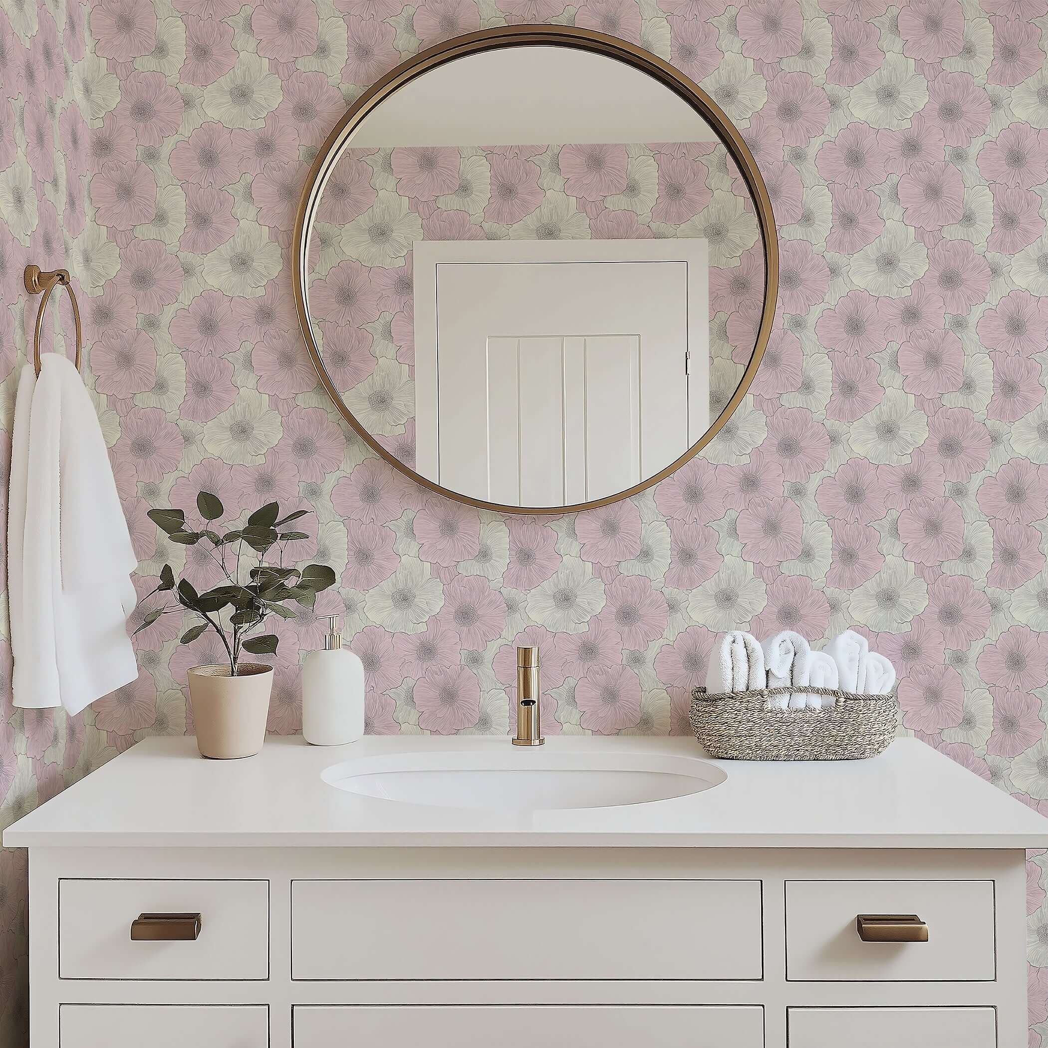 Contemporary bathroom with pink floral wallpaper, round mirror, white vanity, and potted plant, showcasing elegant modern decor.