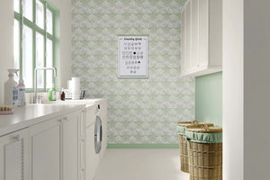 Laundry room with art deco floral wallpaper in mint green and white, featuring fan-shaped flowers and a modern, serene design.