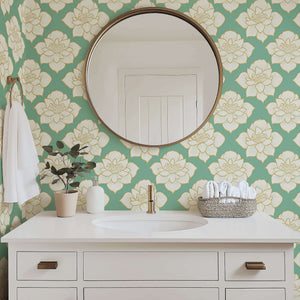 Golden Lotus Bloom II Wallpaper featuring ivory lotus flowers with golden outlines on a teal background in a modern bathroom setting.
