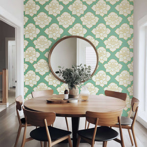 Dining room with Golden Lotus Bloom II wallpaper, featuring white lotus flowers with gold accents on a teal background, modern elegance.