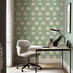 Teal wallpaper with white lotus flowers and gold accents, creating an Art Nouveau-inspired, sophisticated look in a serene office space.