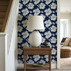 Midnight Hibiscus Elegance wallpaper with white hibiscus flowers on a navy background, adding coastal sophistication to a room.