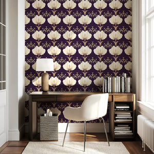 Art Deco wallpaper with cream and gold florals on a purple background, enhancing a stylish room with modern-vintage elegance.