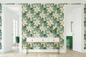 Floral wallpaper with ivory blossoms and sage leaves on a teal background, offering a timeless and elegant look for modern interiors.