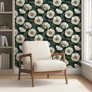 Contemporary wallpaper with ivory flowers and gold outlines on deep green, accented by a modern beige chair, enhancing home decor elegance.