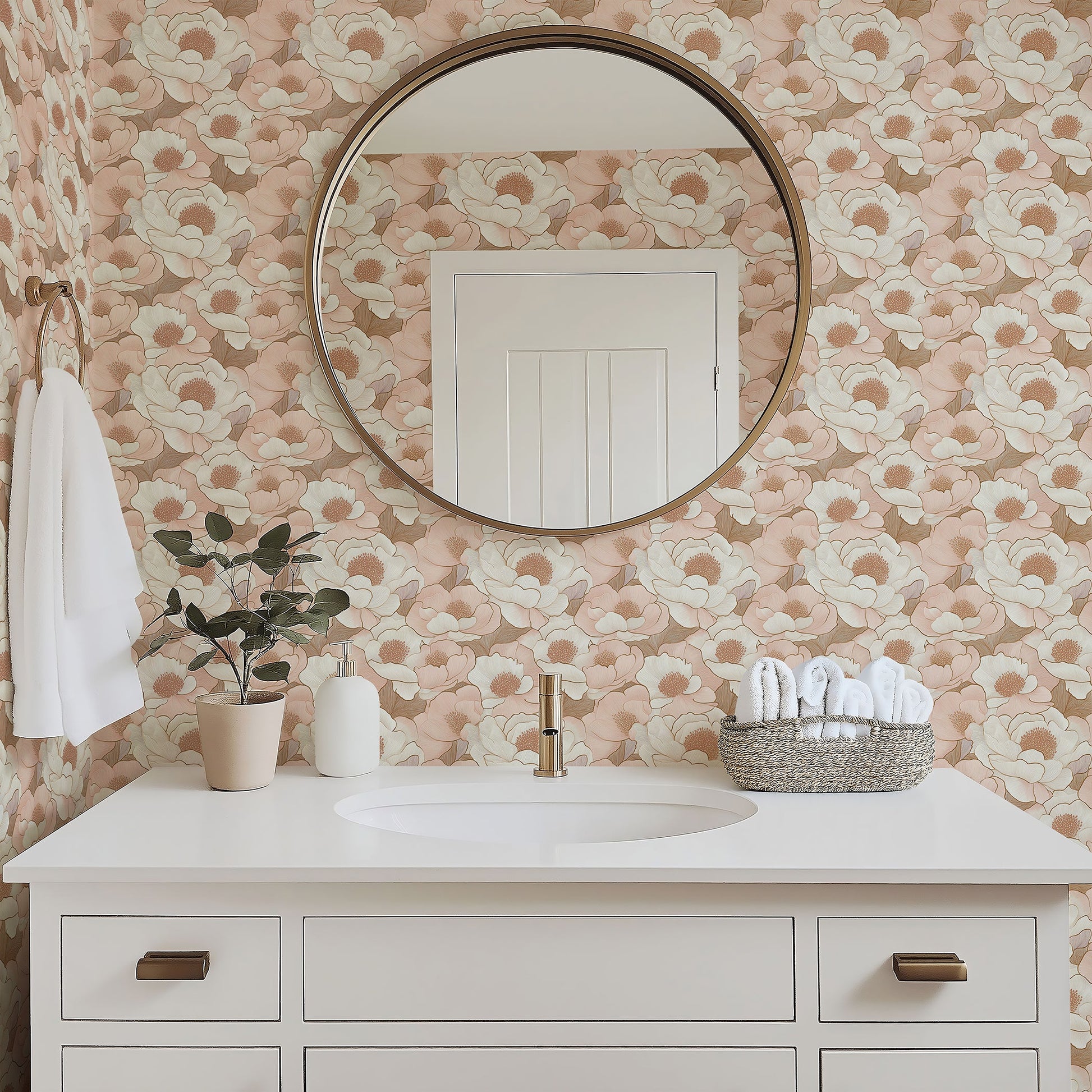 Elegant bathroom with peach floral wallpaper, featuring a round mirror, white vanity, and minimalist decor. Monochromatic floral design.