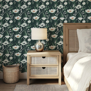 Enchanted Woodland Floral wallpaper featuring white wildflowers and green stems on a dark forest background in a cozy bedroom.