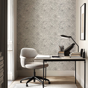 Modern workspace with monochrome Chrysanthemum Dreamscape floral wallpaper in black and white, featuring detailed hand-drawn flowers.