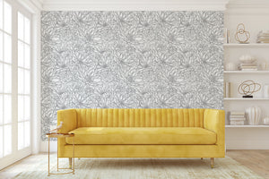 Modern living room with yellow sofa against monochrome black and white chrysanthemum floral wallpaper, adding elegance and flair.