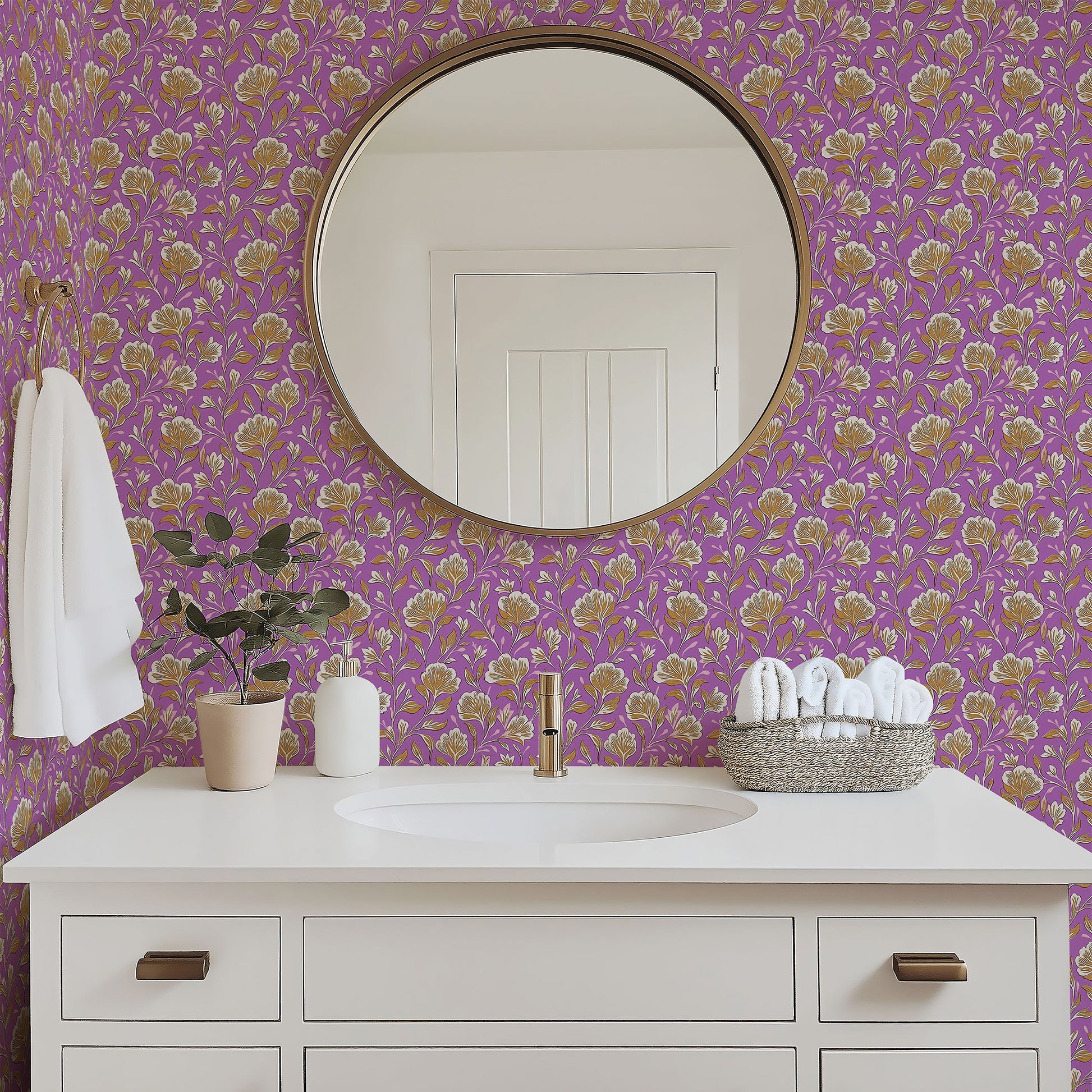 Bathroom with lilac floral wallpaper featuring golden and ivory vintage blooms, mirror, white sink, and decorative accents.