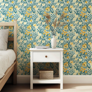 Sunny Fields Wildflower wallpaper with golden yellow, teal, and ivory flowers, bringing cottagecore charm to a cozy bedroom setting.