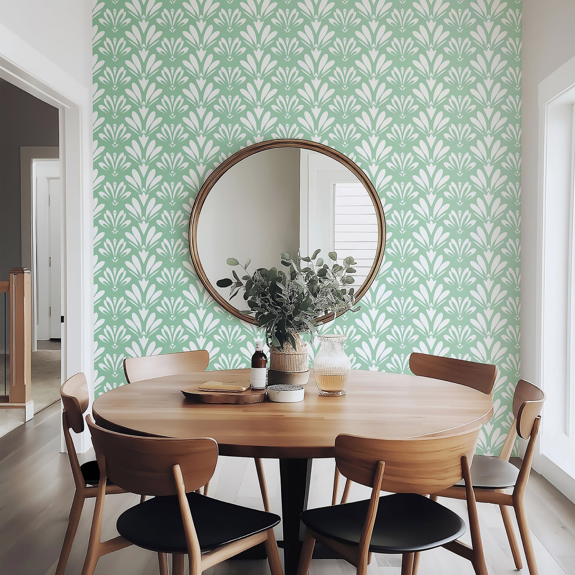 Art Deco Essence wallpaper in mint green with white geometric motifs, enhancing a dining room's vintage elegance and modern style.