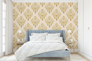 Vintage floral damask wallpaper with elegant golden tones in a bedroom setting, featuring a retro botanical design and symmetry.