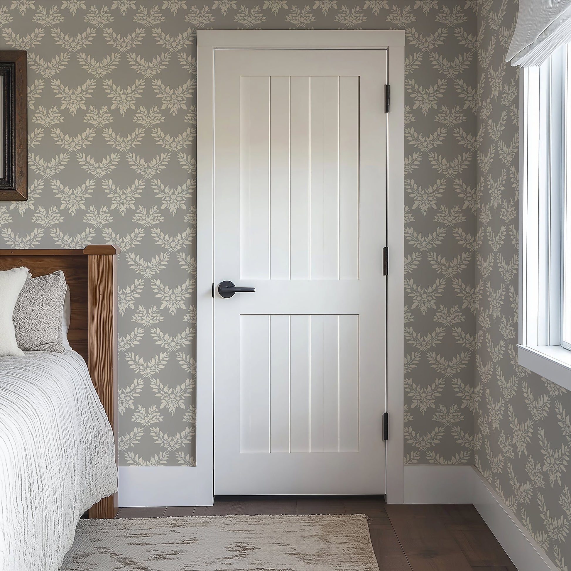 Sophisticated Leaf Elegance wallpaper with ivory laurels and wreaths on a grey background, enhancing traditional bedroom decor with elegance.
