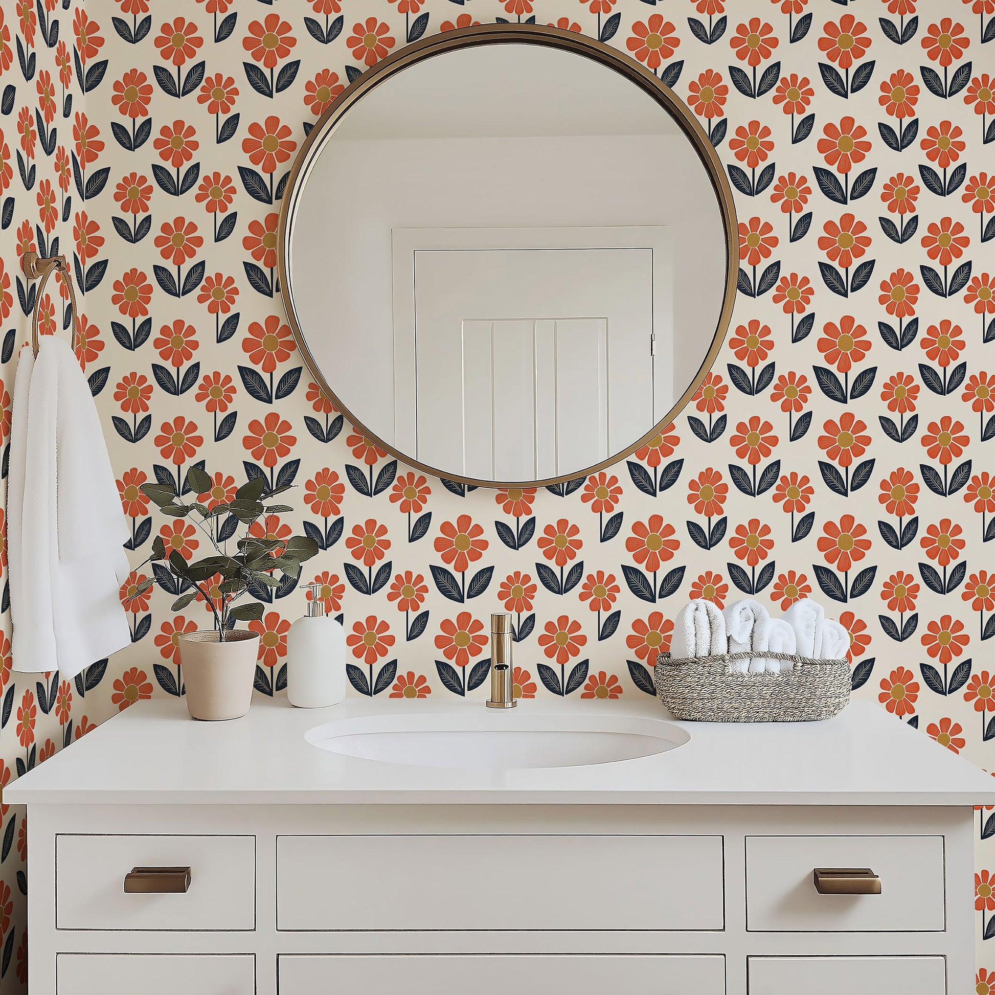 Retro Flower Power wallpaper with orange blossoms and navy leaves in a modern bathroom setup, adding a floral, playful retro touch.