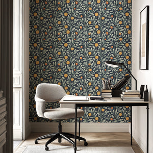 Stylish room with Bright Blooms and Greens floral wallpaper featuring leafy vines and golden-orange flowers, enhancing modern decor.