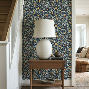 Navy wallpaper with golden-orange floral and leafy vine pattern, enhancing a living space with traditional elegance and nature-inspired beauty.