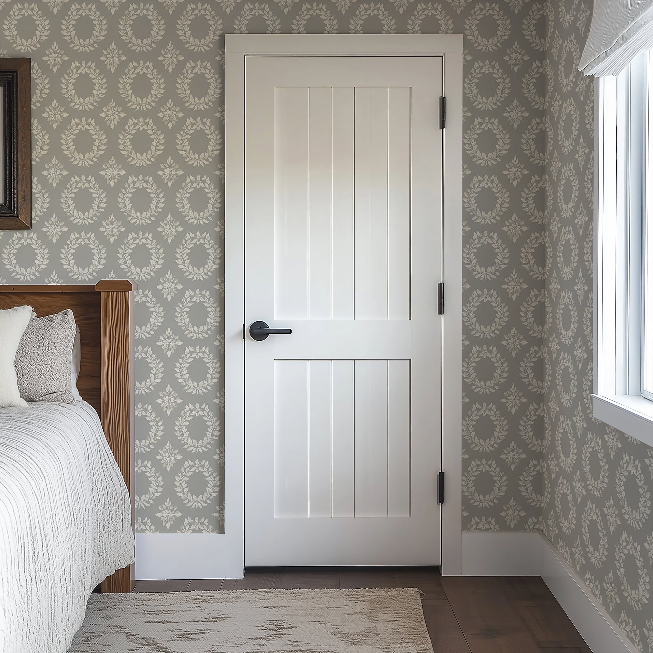 Timeless Floral Wreaths Wallpaper featuring ivory laurel designs on a sage-gray background in a sophisticated bedroom setting.