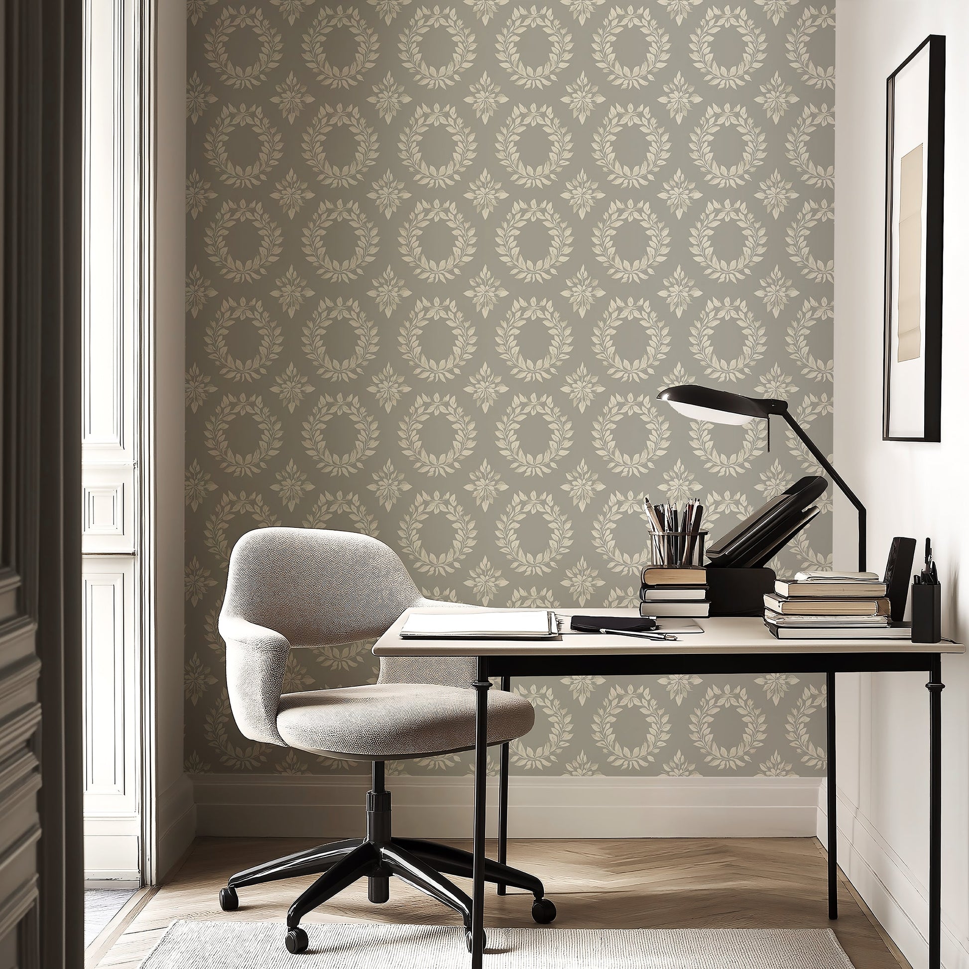 Elegant floral laurel wreaths wallpaper with soft ivory on sage-gray, enhancing a modern study with sophistication.