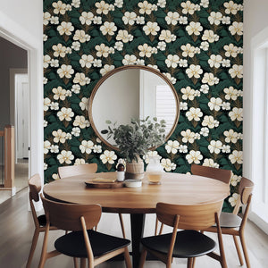 Stylish dining room with Elegant Jungle Escape wallpaper featuring cream flowers, palm fronds, and modern green, black, white decor.