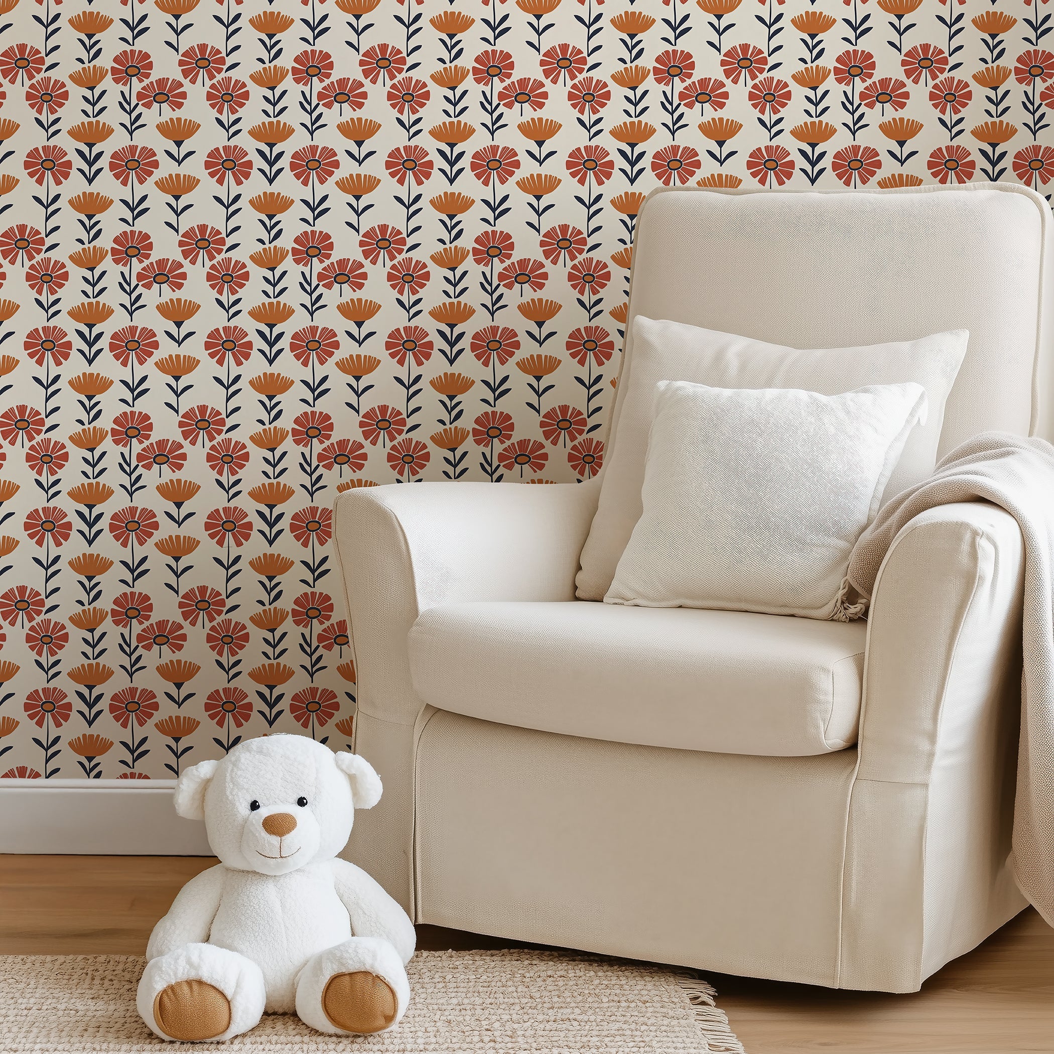 Energetic Flower Field Wallpaper with retro red and orange flowers on cream backdrop decorates a cozy room, ideal for kids' spaces.