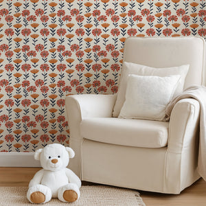 Energetic Flower Field Wallpaper with retro red and orange flowers on cream backdrop decorates a cozy room, ideal for kids' spaces.