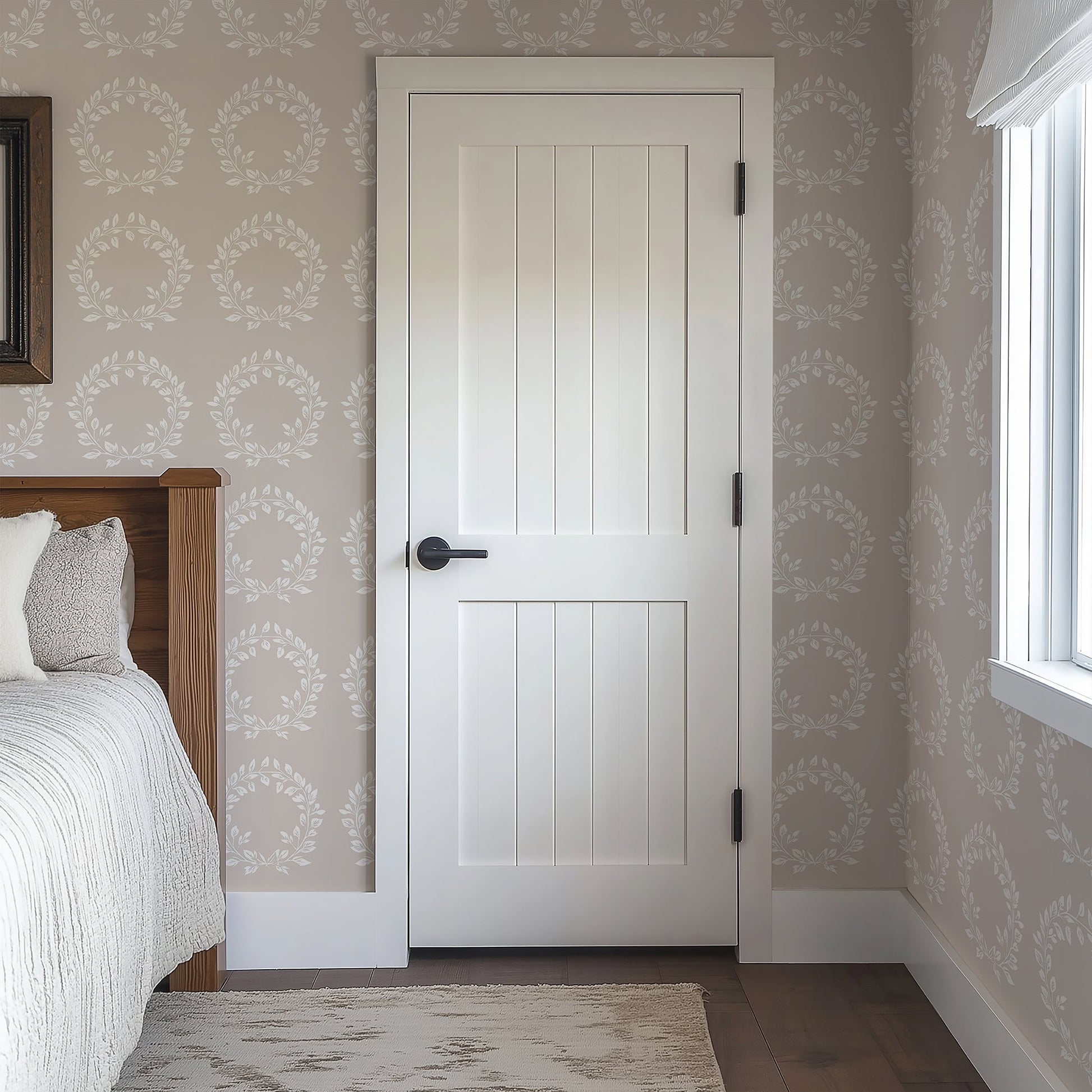 Elegant traditional wallpaper with white laurel wreaths on taupe background, perfect for classic decor in bedrooms and living rooms.