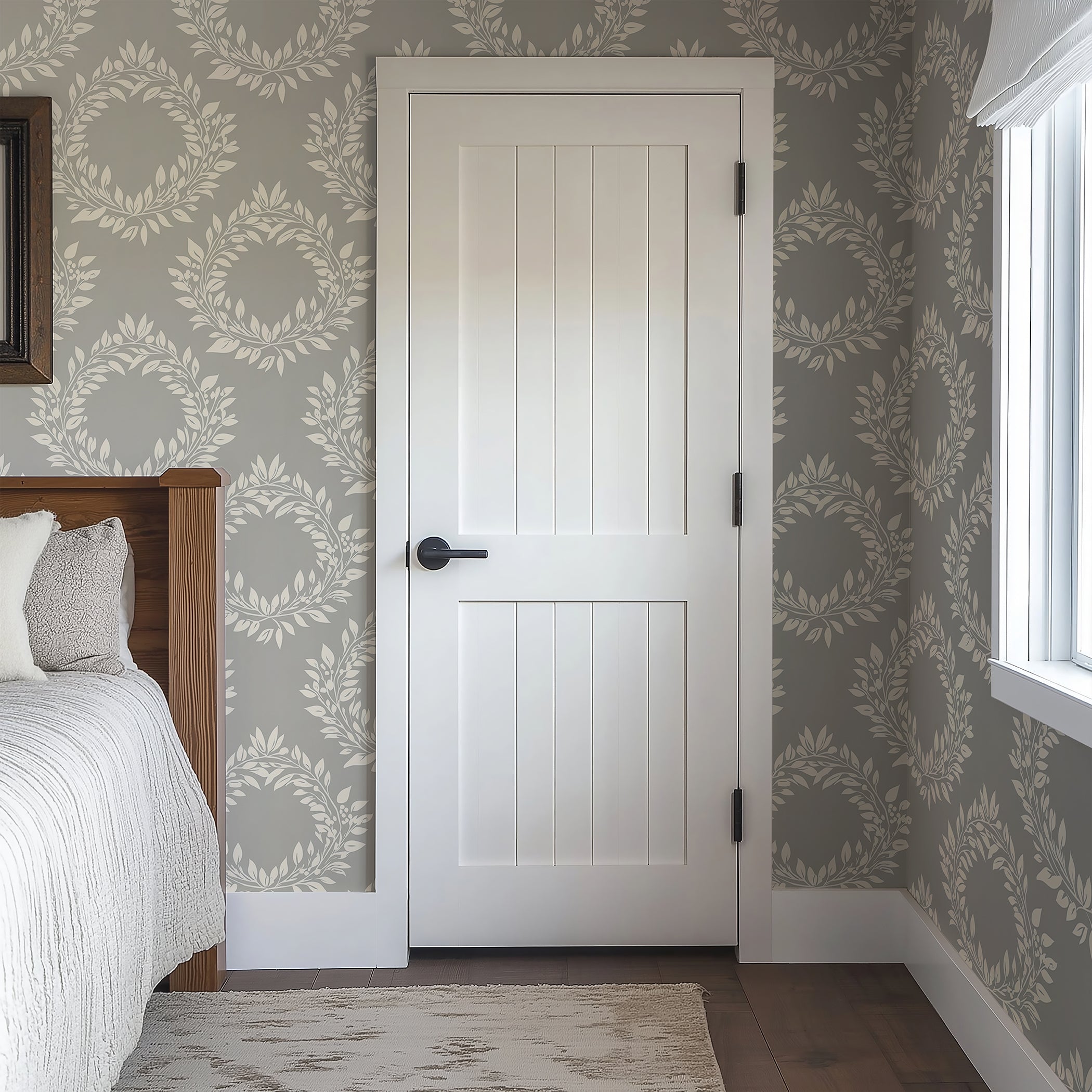 Elegant Leaf Wreaths wallpaper in muted gray with white laurel wreaths, adding traditional sophistication to a bedroom.
