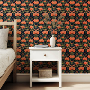 Coral Floral Symphony wallpaper with vivid coral flowers and olive gold leaves on a black background, enhancing a bedroom interior.
