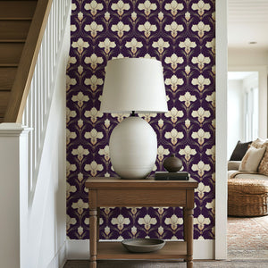 Gilded Iris Motif Wallpaper featuring ivory floral design with gold undertones on a purple background, perfect for an Art Deco interior.