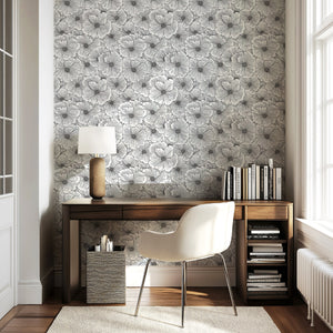 Monochrome floral wallpaper in modern office setting, showcasing hand-drawn flower patterns in black and white.